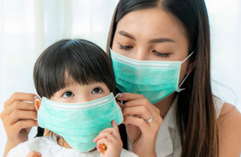 Mother & Daughter wearing Matching Mask under Dr. Henry's Guidence